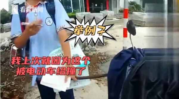  电动车|女子骑电动车没戴头盔，交警拦下后发生争执，路过学生劝架获点赞